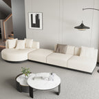 Beige modern L-shaped sectional sofa with pillows and black legs, perfect for corner seating