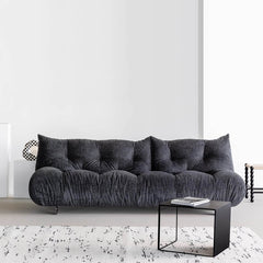 Chic and sleek black microfiber leather couch that converts into a bed