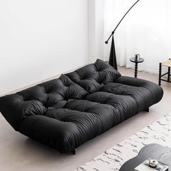 Modern elegant sofa bed in black microfiber leather with clean lines