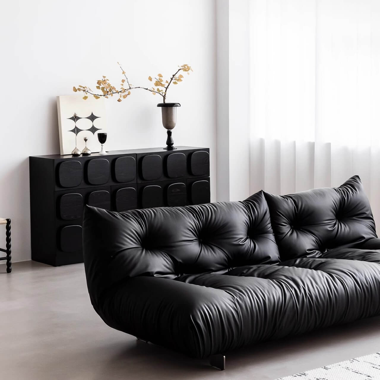 Elegant black microfiber leather sofa bed in minimalist style