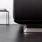 Black microfiber leather sofa with minimalist design, seats up to 3 people