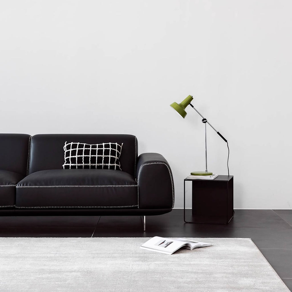 Black microfiber leather sofa with minimalist design, seats up to 3 people