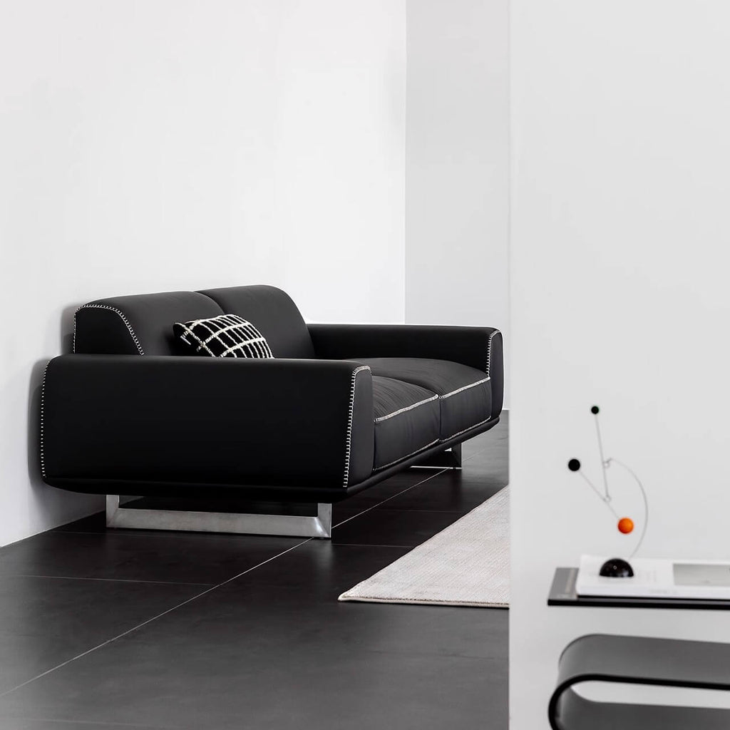 Black microfiber leather sofa with minimalist design, seats up to 3 people