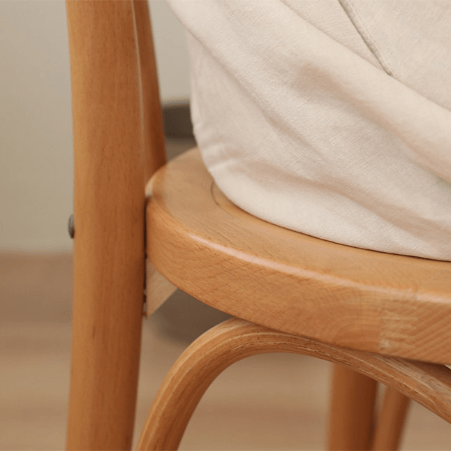 Ergonomic Bentwood Dining Chair with Sculptural Frame and Smooth Finish