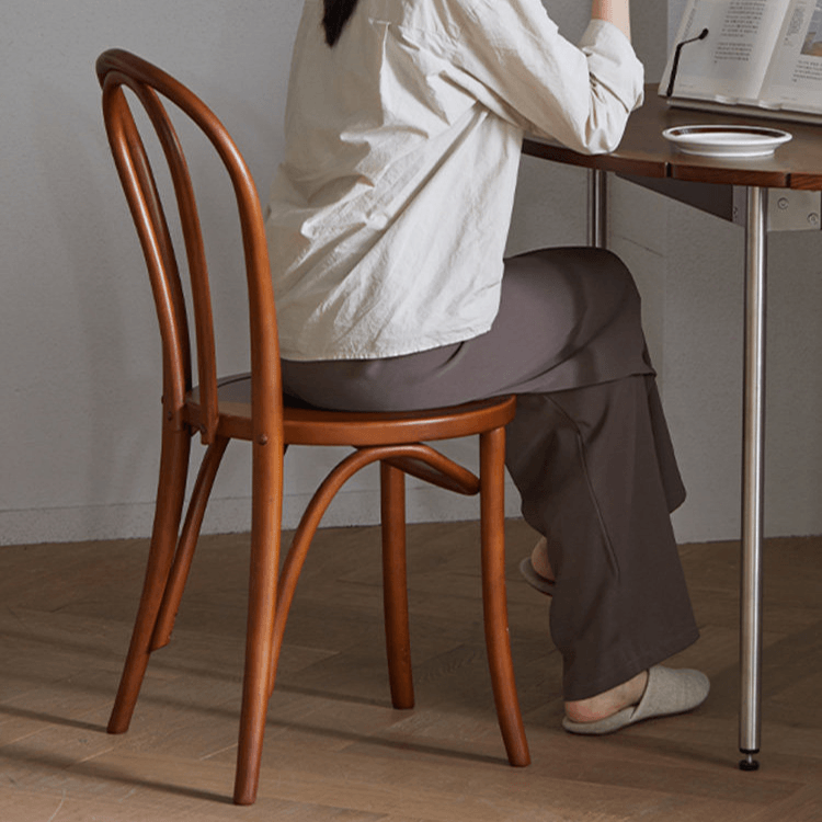 Ergonomic Bentwood Dining Chair with Sculptural Frame and Smooth Finish