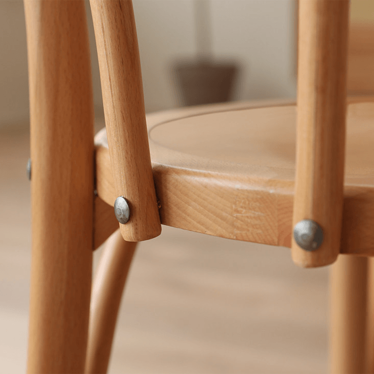 Ergonomic Bentwood Dining Chair with Sculptural Frame and Smooth Finish