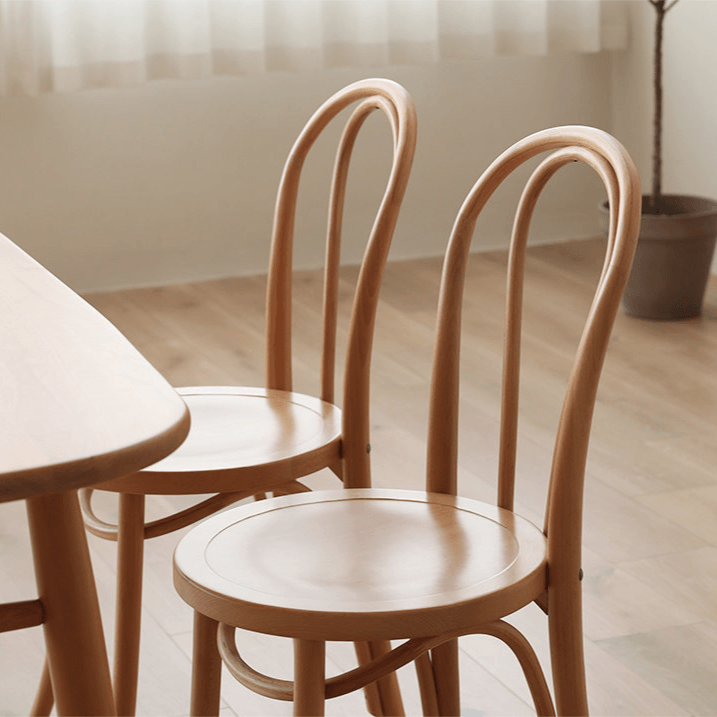 Ergonomic Bentwood Dining Chair with Sculptural Frame and Smooth Finish