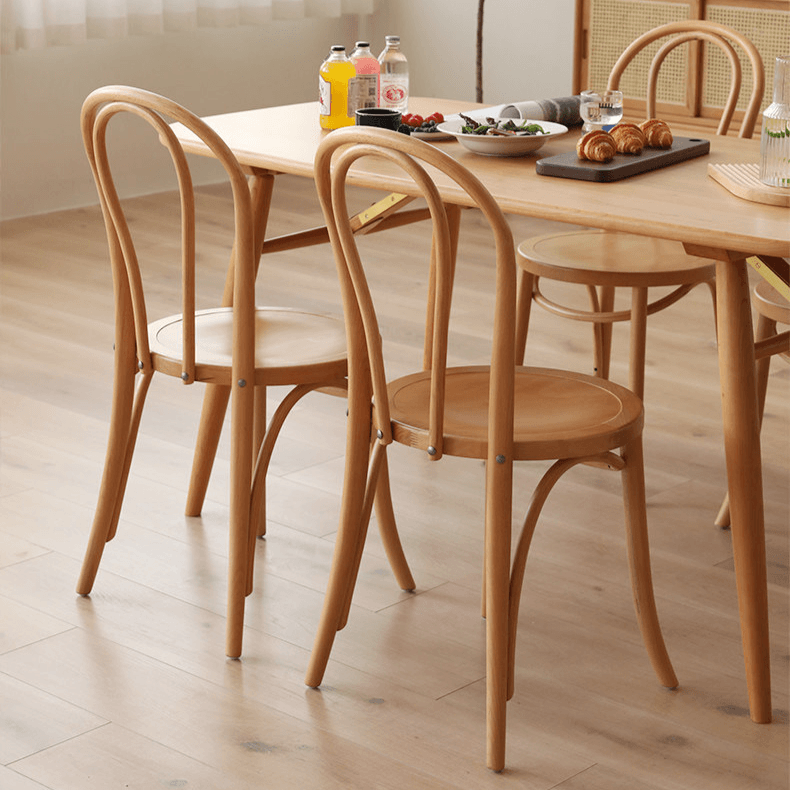 Ergonomic Bentwood Dining Chair with Sculptural Frame and Smooth Finish