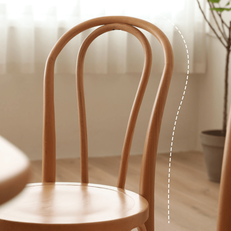 Ergonomic Bentwood Dining Chair with Sculptural Frame and Smooth Finish