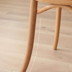 Ergonomic Bentwood Dining Chair with Sculptural Frame and Smooth Finish
