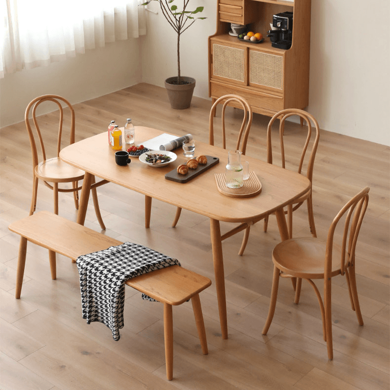 Ergonomic Bentwood Dining Chair with Sculptural Frame and Smooth Finish