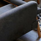 Black Scandinavian style small sofa with wood frame and faux leather upholstery