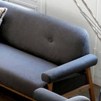 Black Scandinavian style small sofa with wood frame and faux leather upholstery