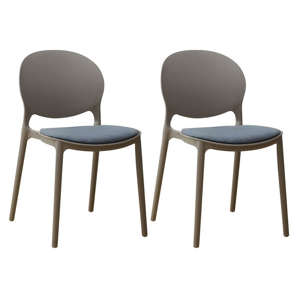 Scandinavian plastic dining chair with open back and four legs, ideal for home use