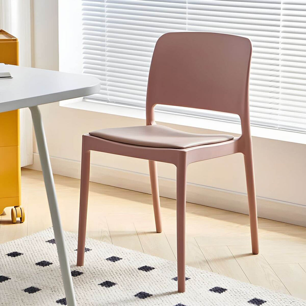 Scandinavian plastic and acrylic dining chair with low backrest and armless design