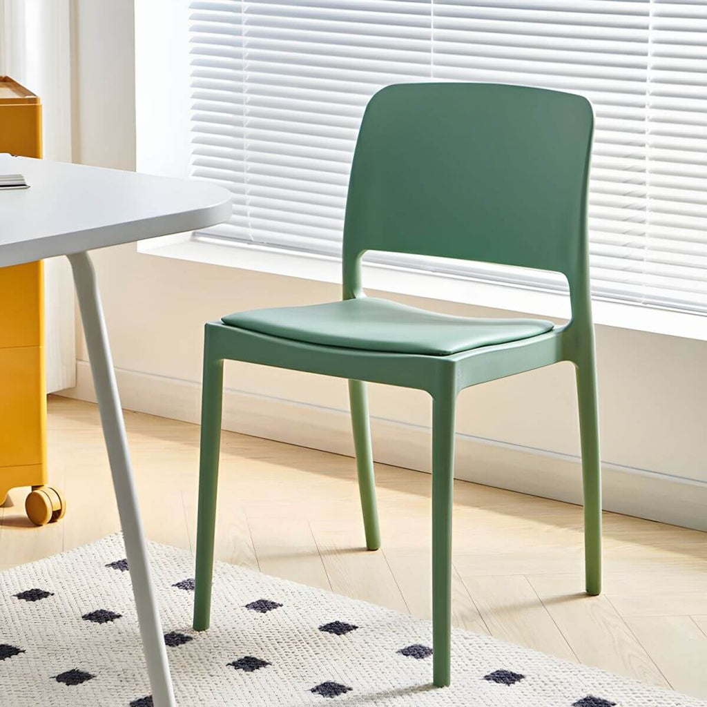 Scandinavian plastic and acrylic dining chair with low backrest and armless design