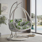 Tropical porch swing with corrosion-resistant cushions, alloy chain, and sturdy stand included