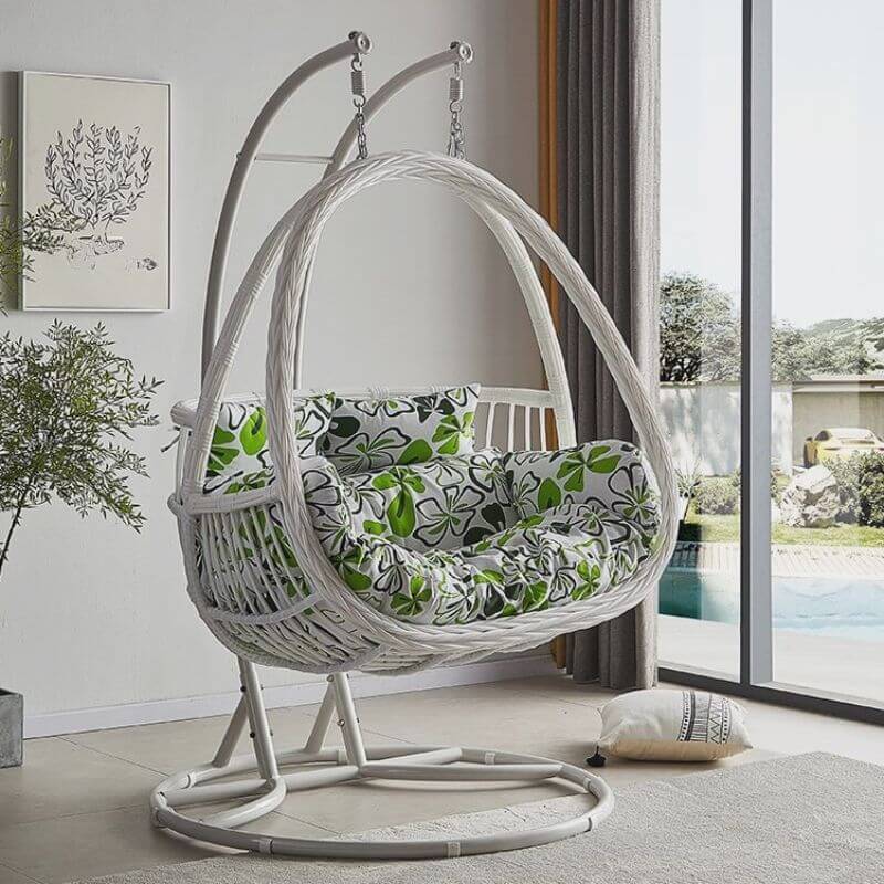 Tropical porch swing with corrosion-resistant cushions, alloy chain, and sturdy stand included