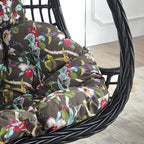 Tropical upholstered porch swing with metal chain and included stand for outdoor relaxation