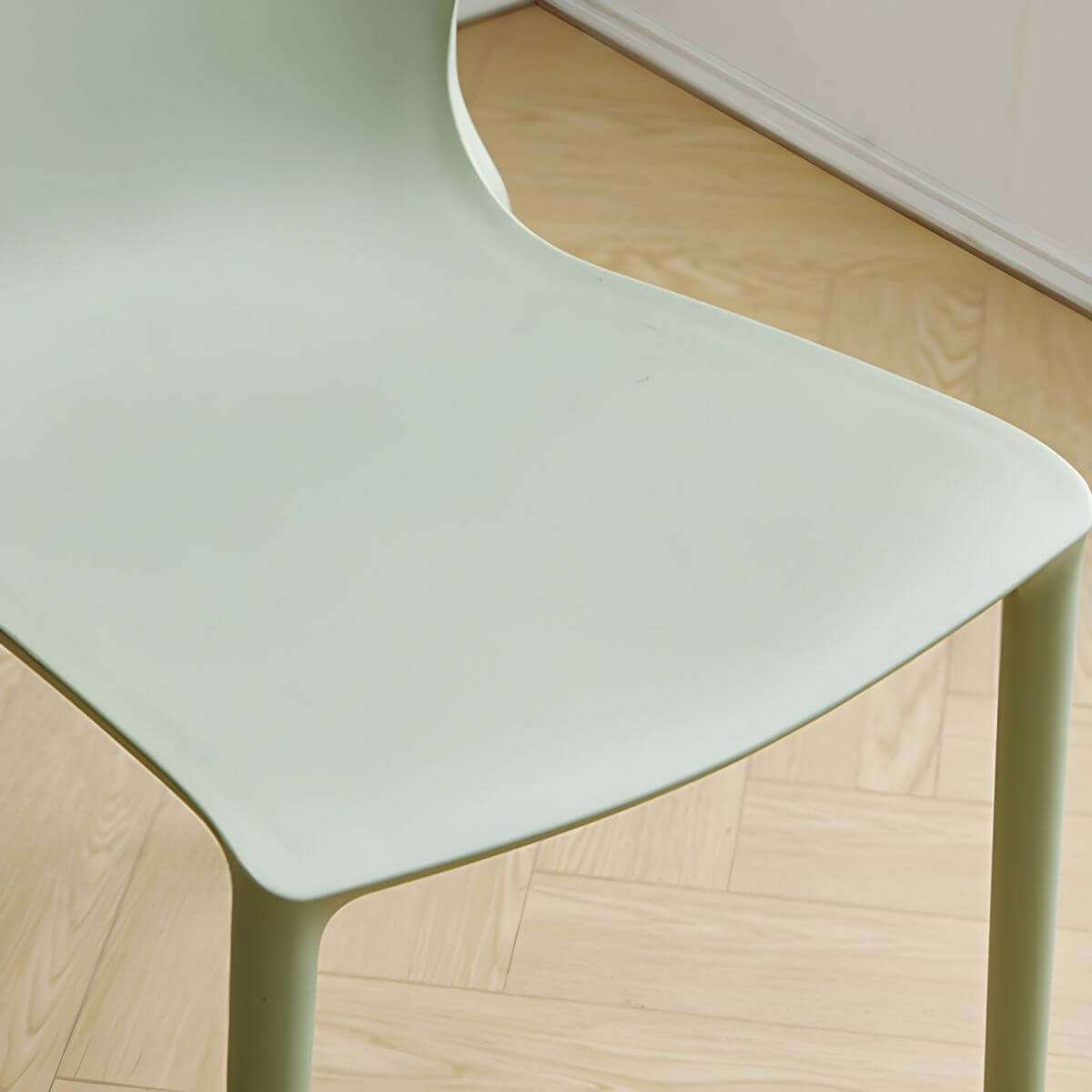 Stackable modern Scandinavian plastic and acrylic chair for kitchen and dining use