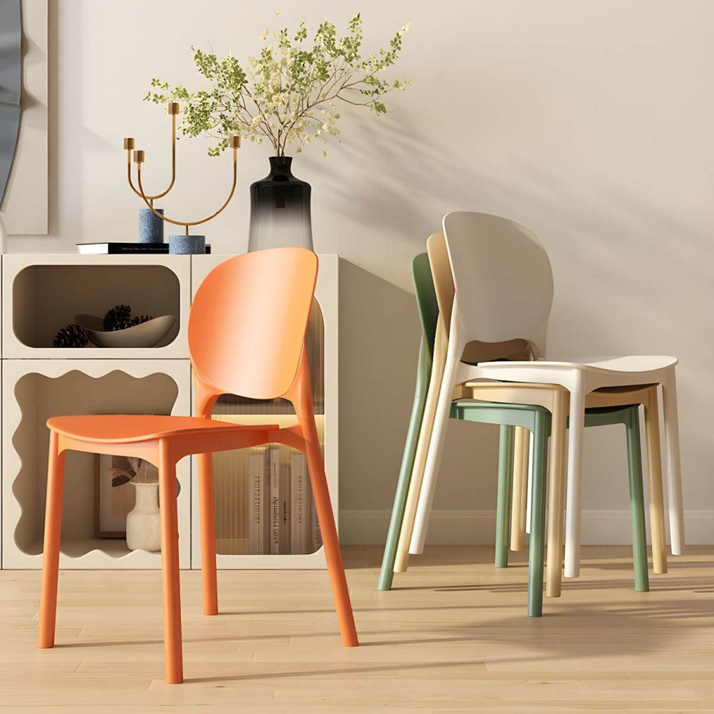 Stackable Scandinavian side chair with open back made of plastic and acrylic for dining