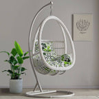 Tropical porch swing with corrosion-resistant cushions, alloy chain, and sturdy stand included