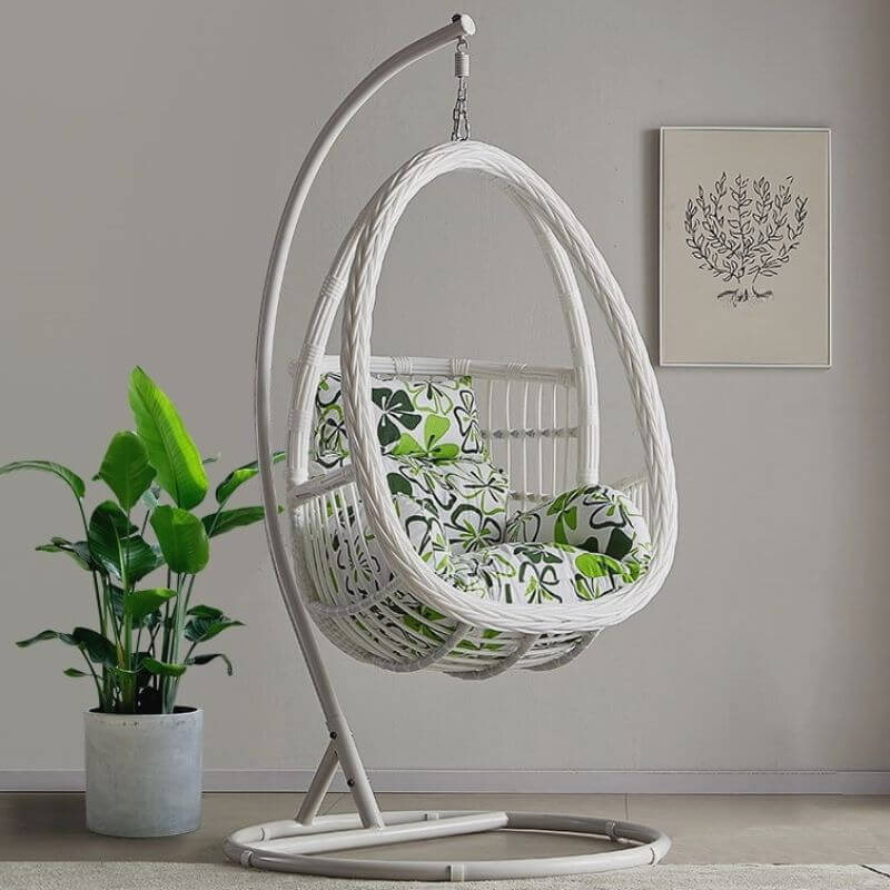 Tropical porch swing with corrosion-resistant cushions, alloy chain, and sturdy stand included