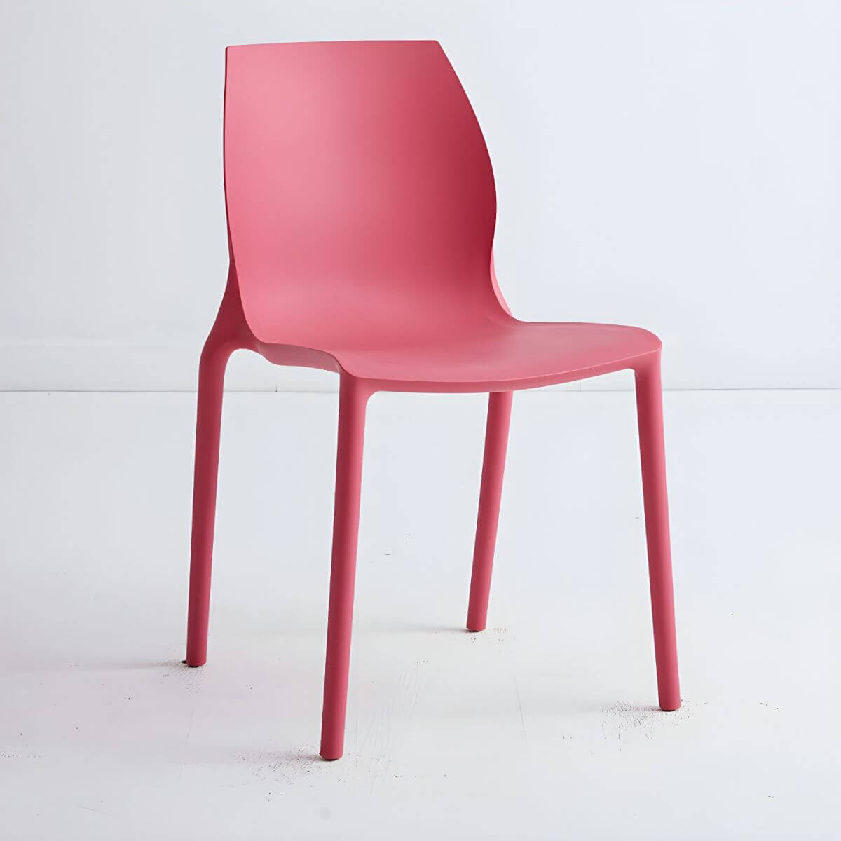 Stackable modern Scandinavian plastic and acrylic chair for kitchen and dining use