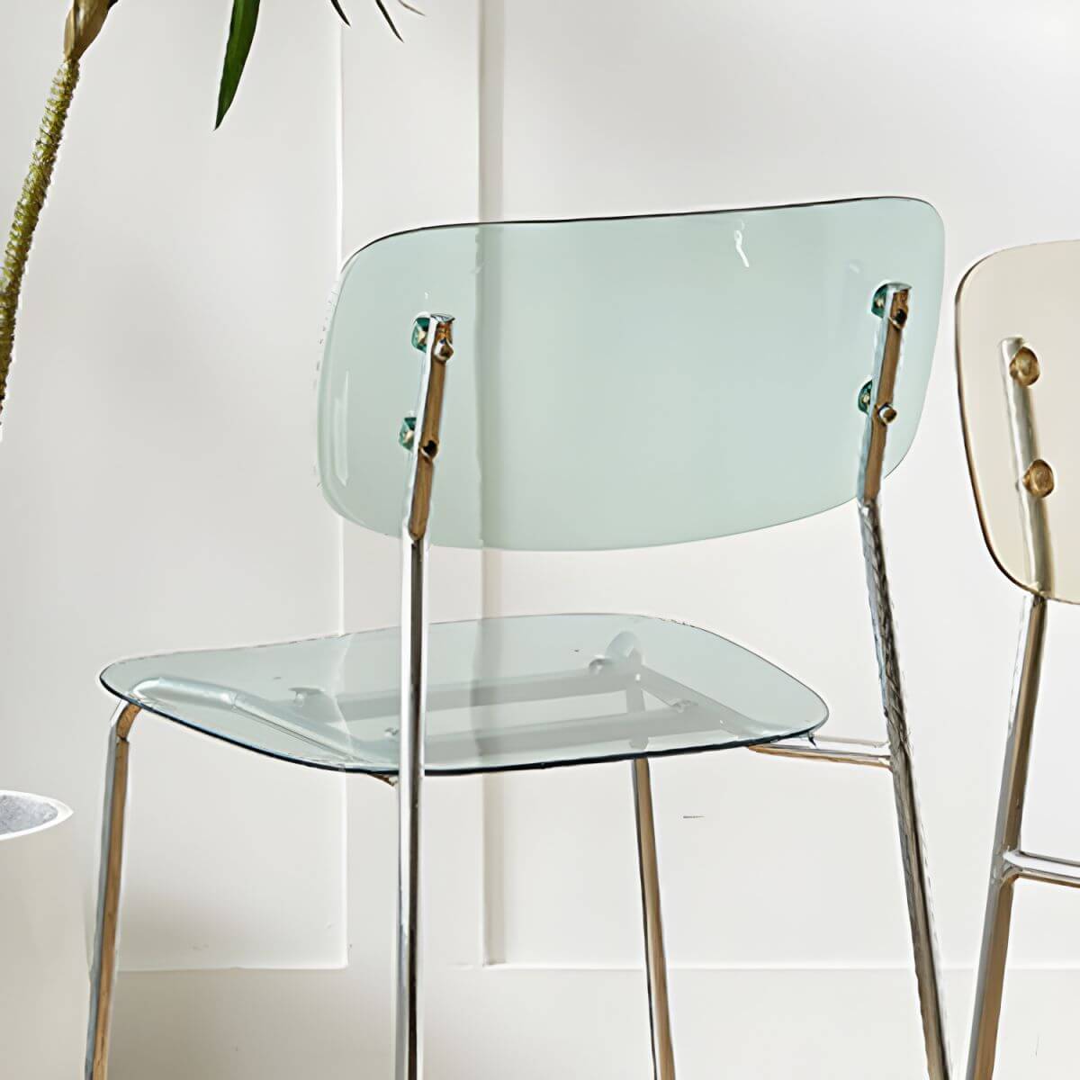 Transparent acrylic dining chair with modern design, perfect for living room and kitchen seating