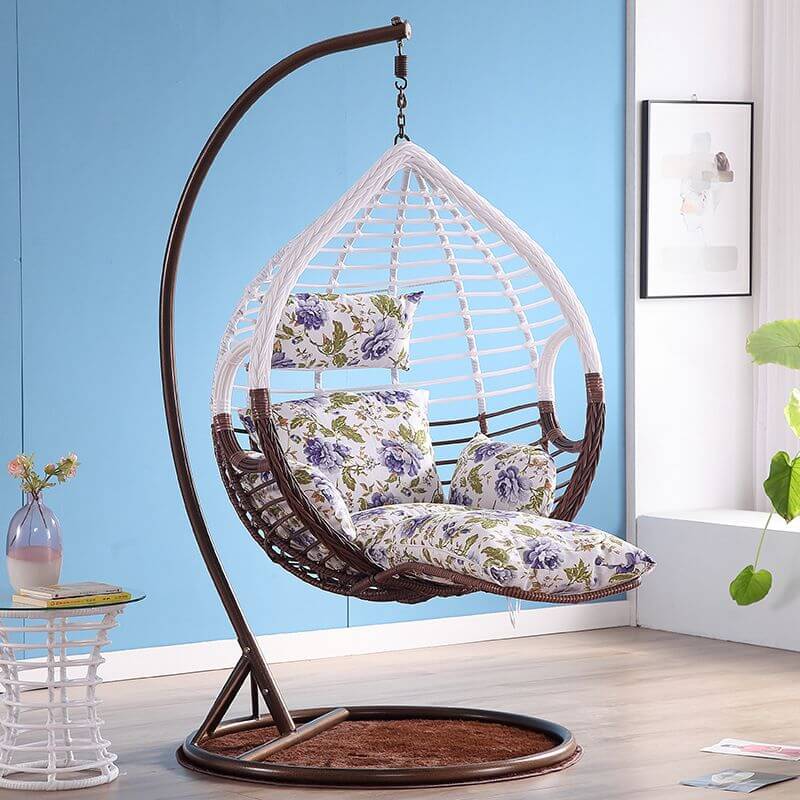 Metal porch swing with cushions, chain, and stand, designed to be heat resistant for outdoor use