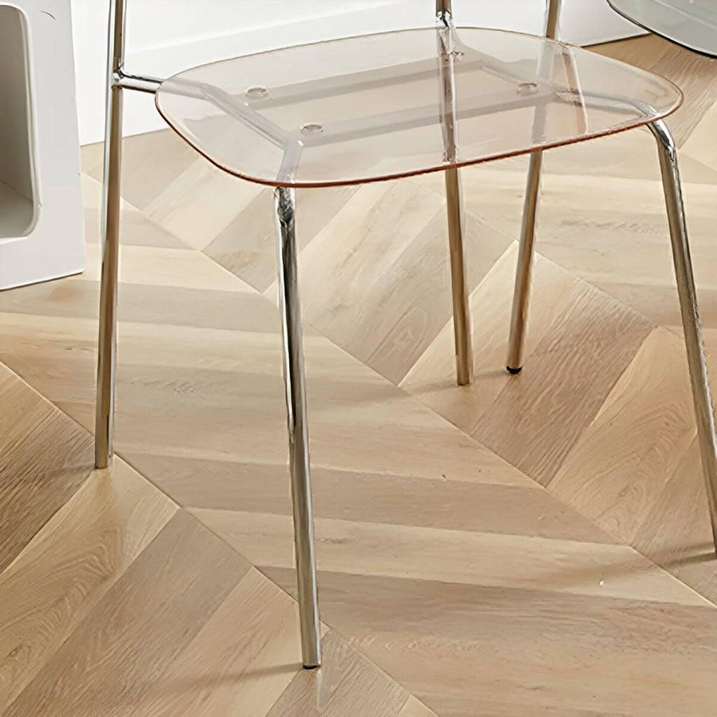 Transparent acrylic dining chair with modern design, perfect for living room and kitchen seating