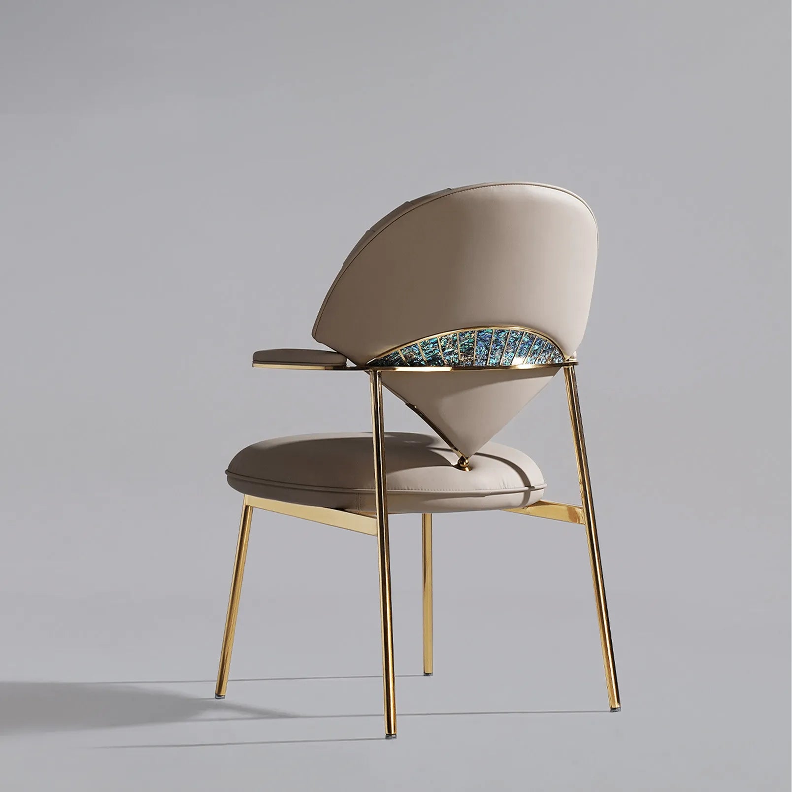 Fan-shaped dining chair with pleated leather and abalone inlay on champagne gold brass frame