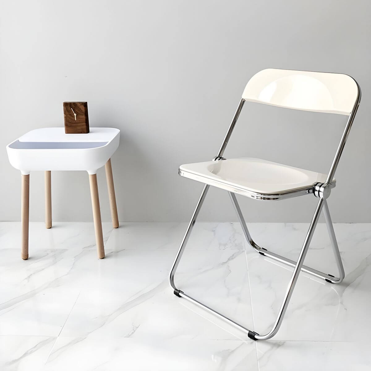 Contemporary acrylic folding armless chair with open back, ideal for dining rooms