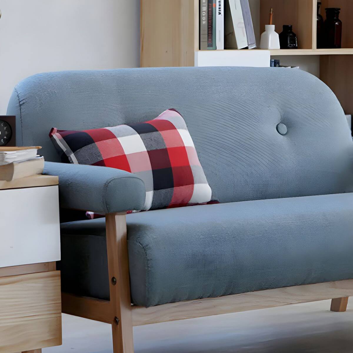 Black Scandinavian style small sofa with wood frame and faux leather upholstery