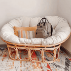 Cozy natural rattan papasan chair available in single or double size for comfortable lounging