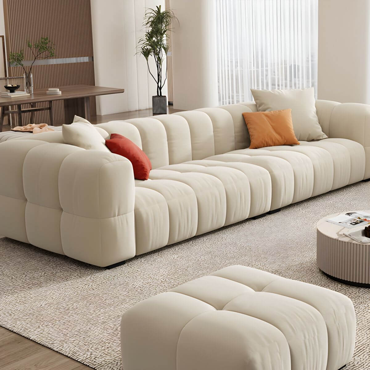 Beige upholstered wood sofa with square arms and sewn pillow back for modern living rooms