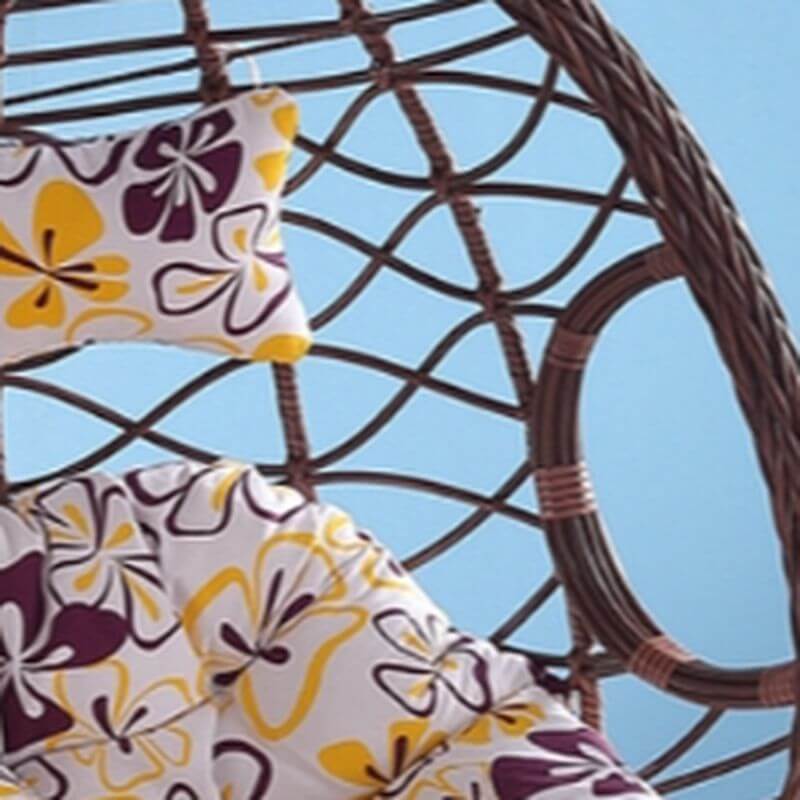 Metal porch swing with cushions, chain, and stand, designed to be heat resistant for outdoor use