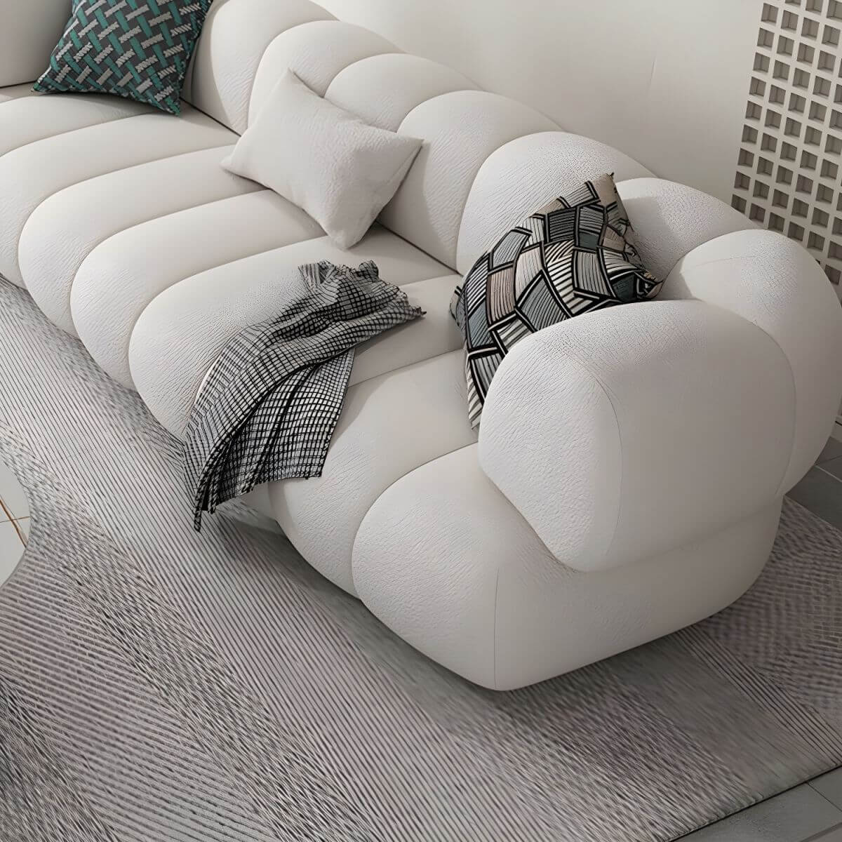 White Scandinavian fabric sofa with biscuit back and tuxedo arms