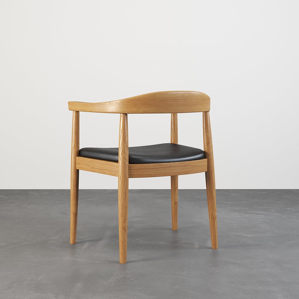 Set of four modern curved back dining chairs with walnut wooden frame and upholstered leather seats