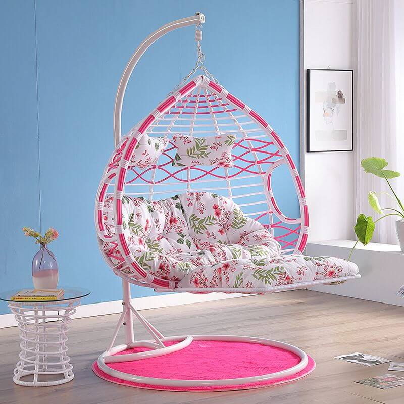 Metal porch swing with cushions, chain, and stand, designed to be heat resistant for outdoor use