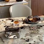 Elliptical white marble effect dining table with anti-stain and scratch-tolerant finish, seats 6 to 8