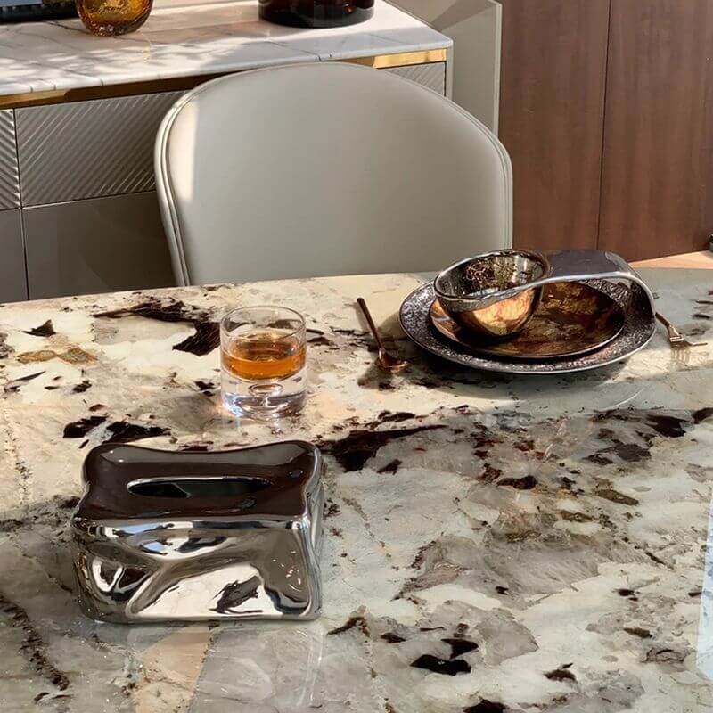 Elliptical white marble effect dining table with anti-stain and scratch-tolerant finish, seats 6 to 8