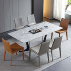Single dining chair with gray saddle leather seat and carbon steel frame, minimalist luxury design