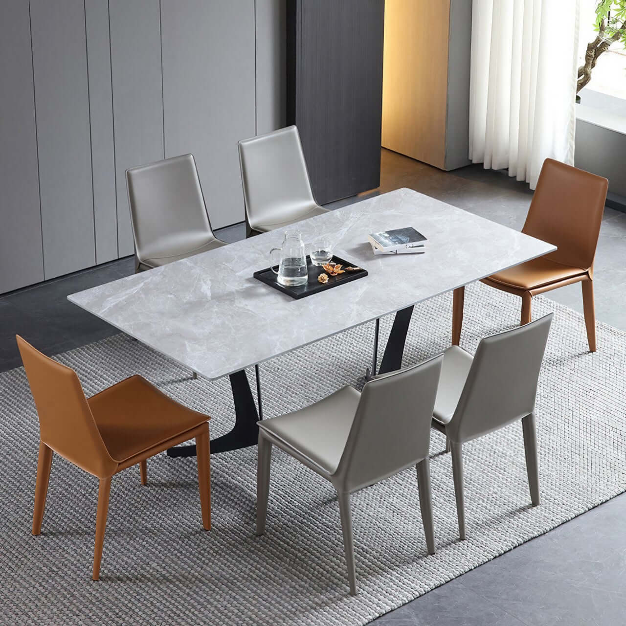 Single dining chair with gray saddle leather seat and carbon steel frame, minimalist luxury design