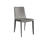 Single dining chair with gray saddle leather seat and carbon steel frame, minimalist luxury design