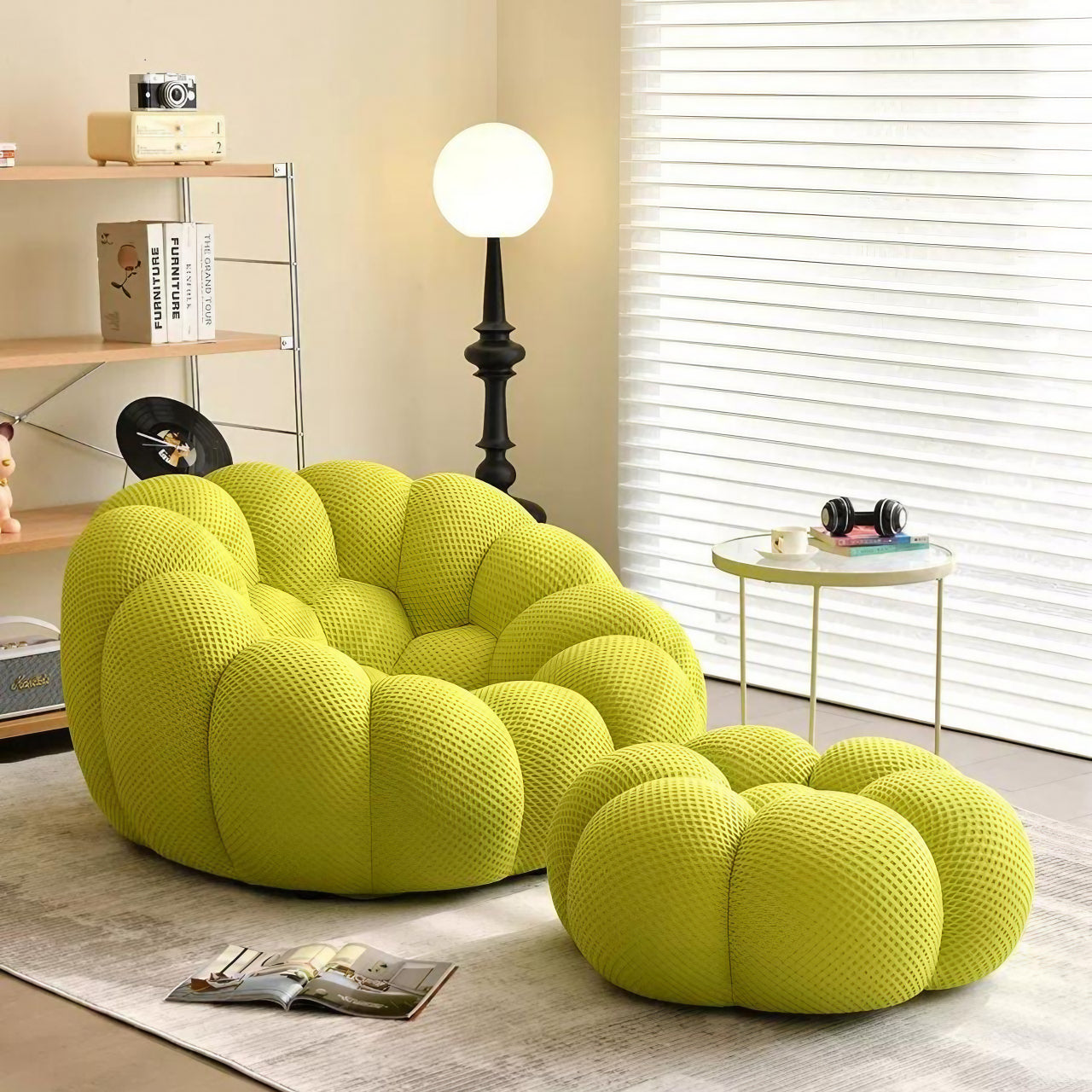 Green football-shaped lazy sofa single chair with 3D knit fabric in a modern living room setting