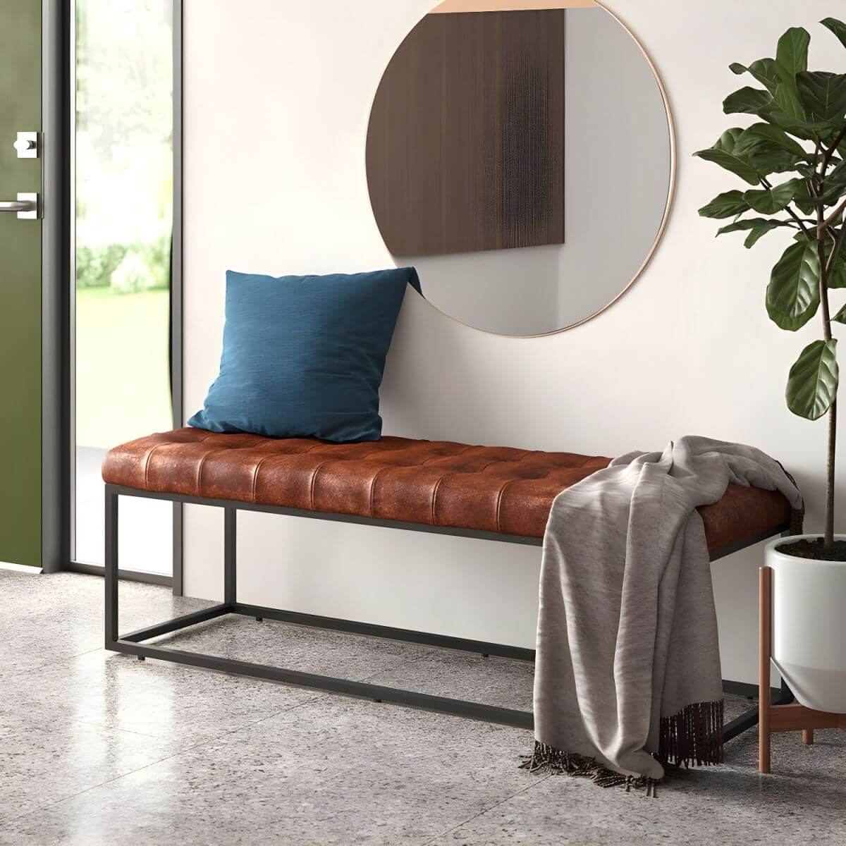 Industrial-style faux leather entryway bench with tufted cushion and matte black steel frame