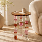 Jewelry-Inspired Acrylic Side Table Series With Amber Tones and Sculptural Legs