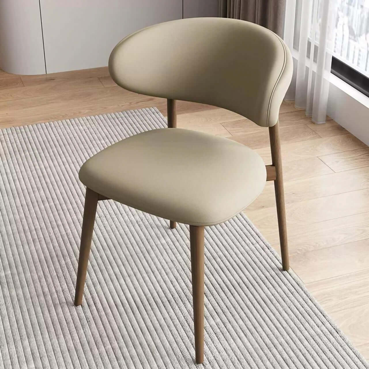 Minimalist khaki dining chair with scratch-resistant leather and solid wood frame main product image