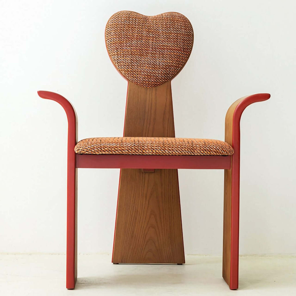 Light brown fabric dining chair with heart-shaped back and creative design